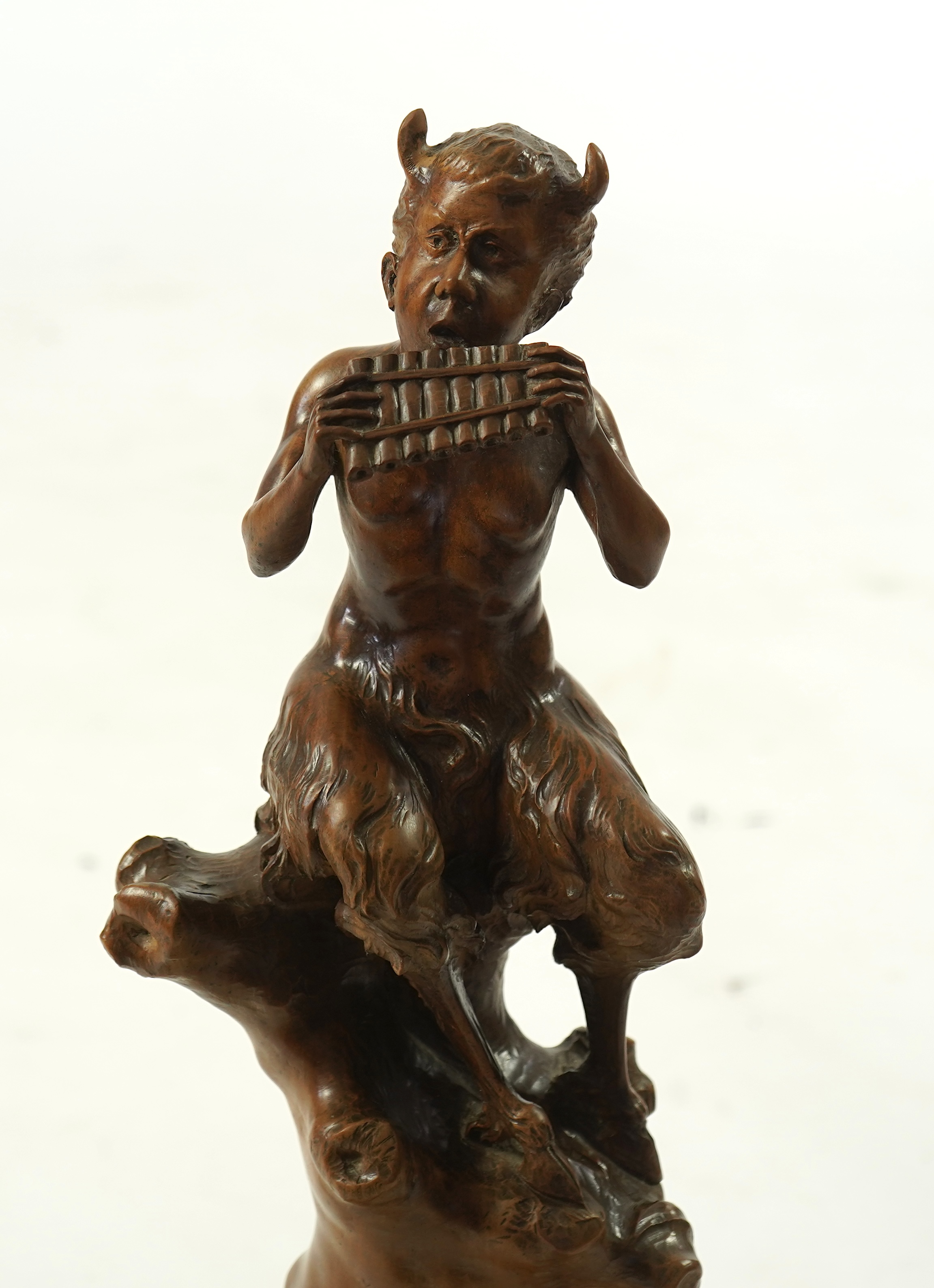 A late 19th century French carved walnut figure of Pan